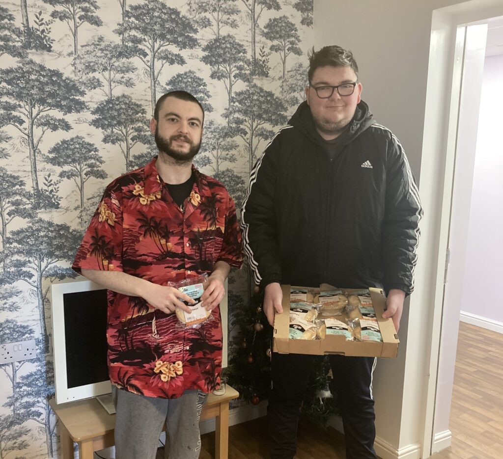 Jake and James from Southport delighted to receive a donation of pies from Cottoms.