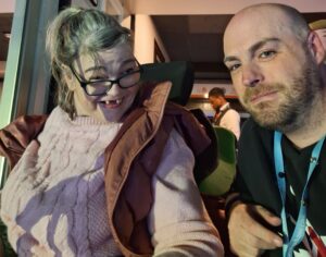 Tracy and her Support Worker, Scott, enjoying the VIP experience at Disney on Ice.